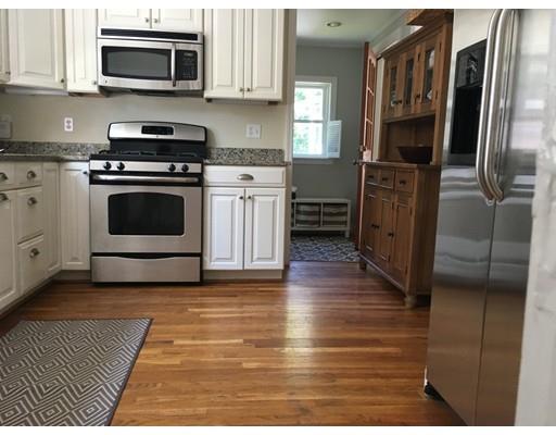36 Overlook Road Arlington, MA 02474 - Photo 14 of 26 a kitchen with stainless steel appliances granite countertop a stove a microwave and a refrigerator