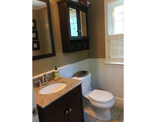 36 Overlook Road Arlington, MA 02474 - Photo 15 of 26 a bathroom with a granite countertop toilet sink and mirror