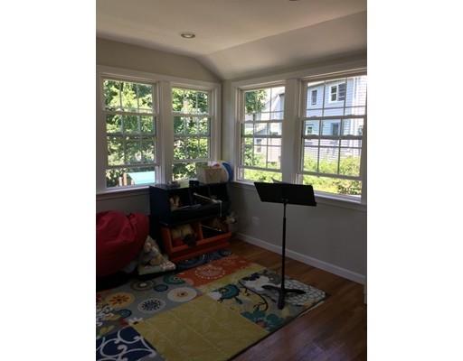 36 Overlook Road Arlington, MA 02474 - Photo 19 of 26 a living room with furniture and a floor to ceiling window