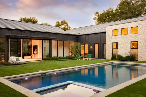 a view of swimming pool with a yard and seating space
