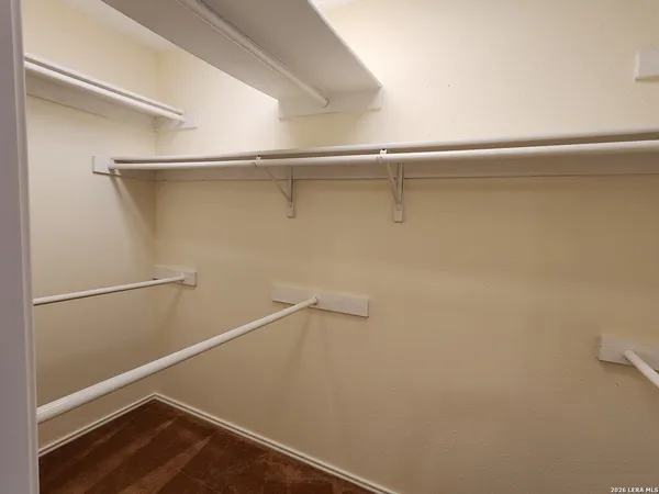 a view of an empty walk in closet