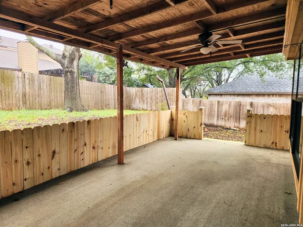 a view of an empty room with a large window