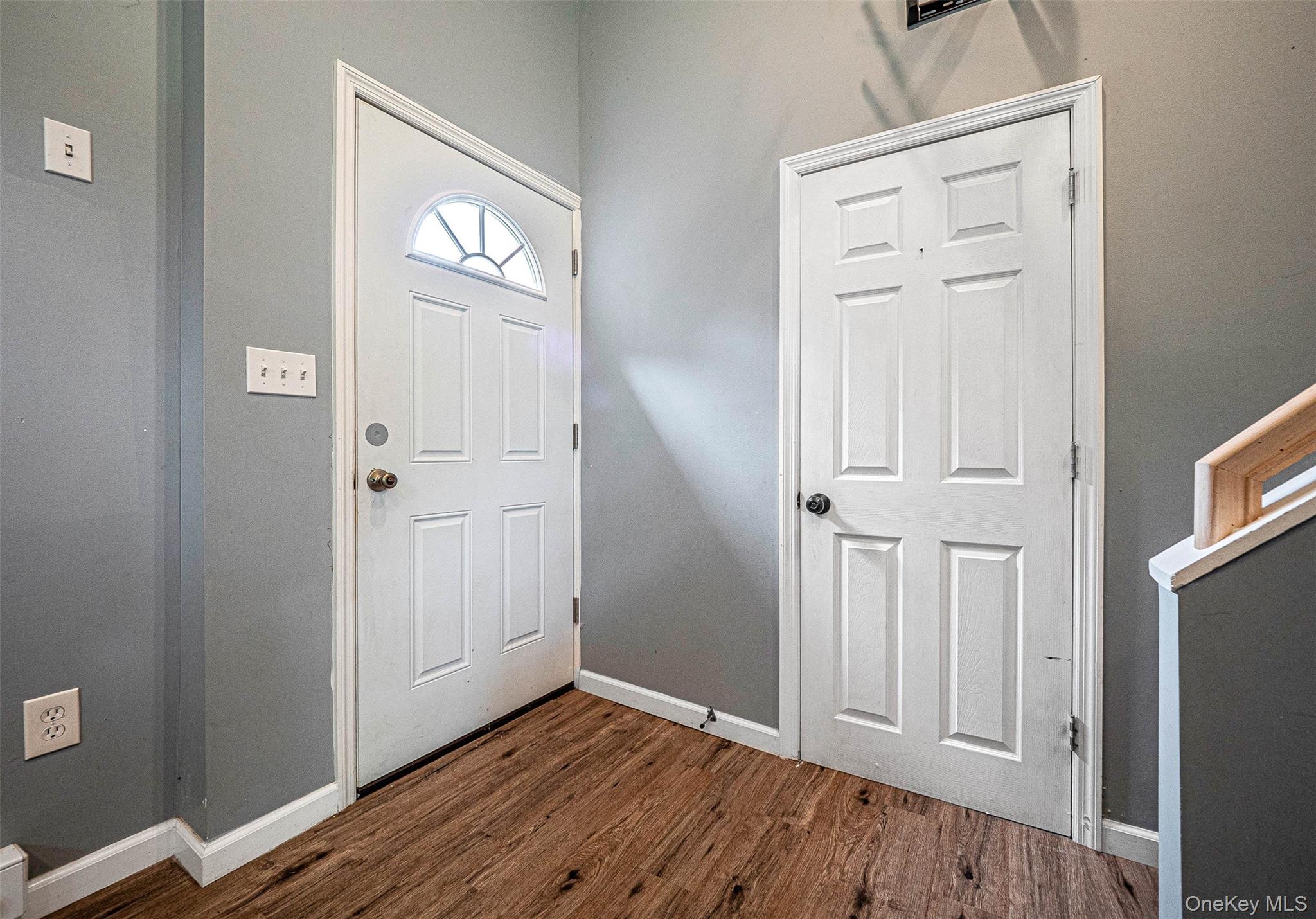 784 County Rte 12 New Hampton, NY 10958 - Photo 7 of 19 an empty room with wooden floor & entryway