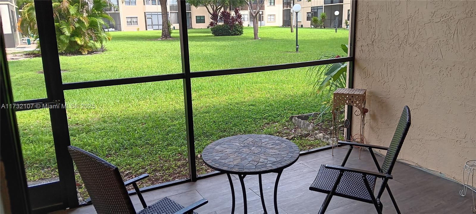 250 Gate Road, Unit 160 Hollywood, FL 33024 - Photo 15 of 33 a view of a chairs in backyard of the house