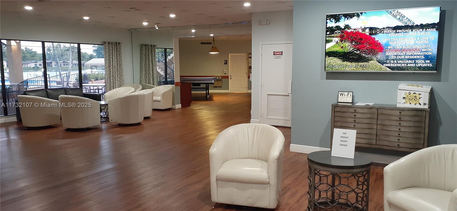 250 Gate Road, Unit 160 Hollywood, FL 33024 - Photo 20 of 33 a living room with furniture and a flat screen tv