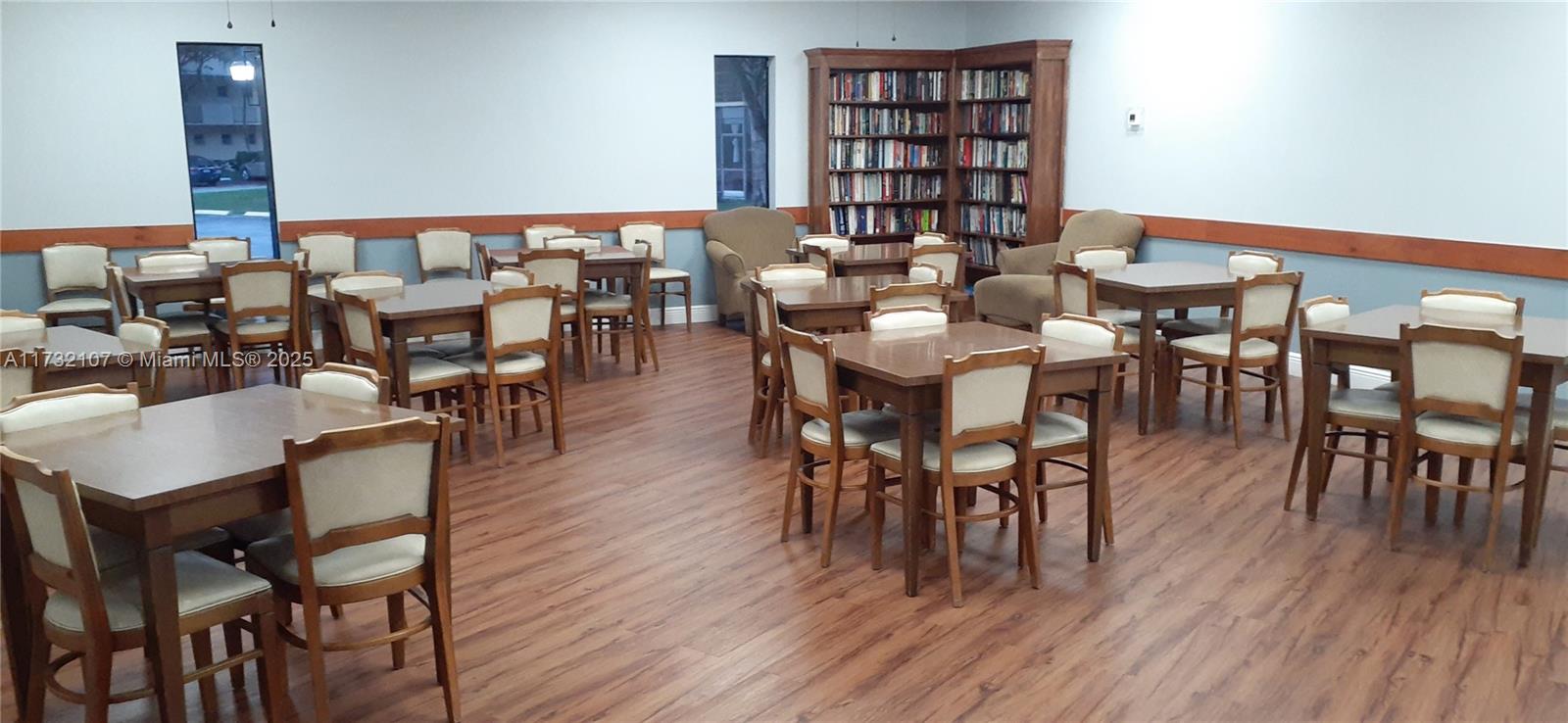 250 Gate Road, Unit 160 Hollywood, FL 33024 - Photo 21 of 33 a view of a dining room with furniture and wooden floor