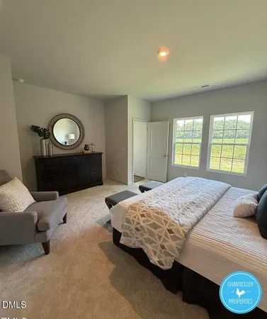 a bedroom with a bed and a dresser