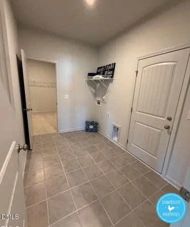a view of a livingroom with wooden floor and window