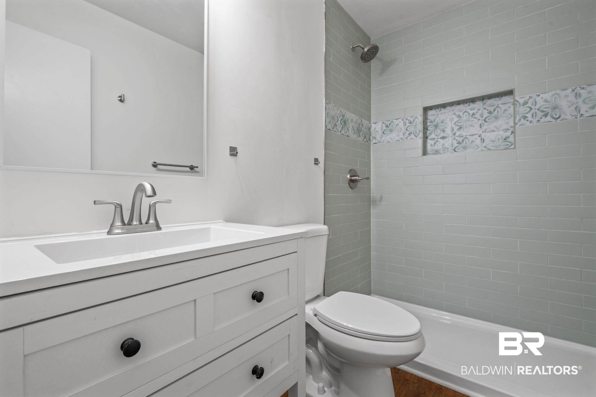 5734 Pheasant Court Theodore, AL 36582 - Photo 16 of 23 Bathroom featuring vanity and a tile shower