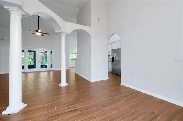 a view of an entryway with wooden floor and a fire place