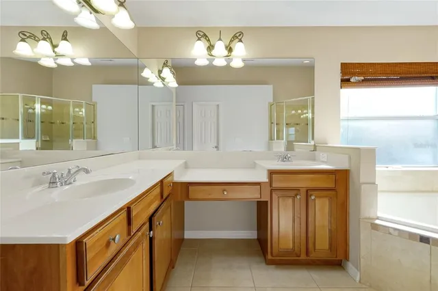 a bathroom with a sink vanity and a mirror