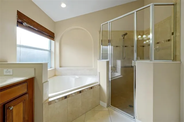 a bathroom with a shower and a sink