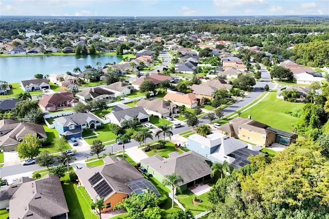 an aerial view of residential house with outdoor space and swimming pool