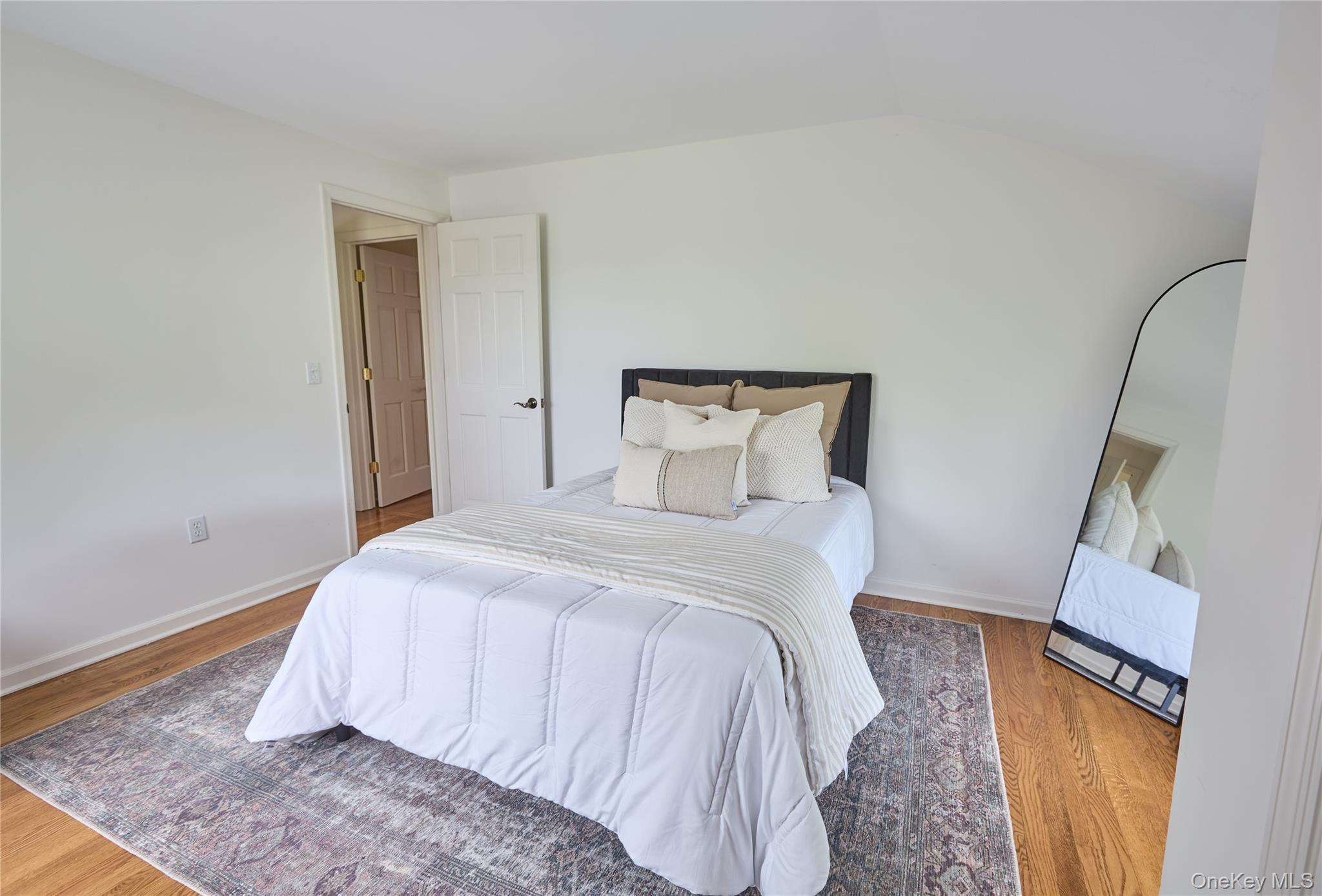 2039 Salt Point Turnpike Salt Point, NY 12578 - Photo 15 of 35 a bedroom with a bed and a mirror