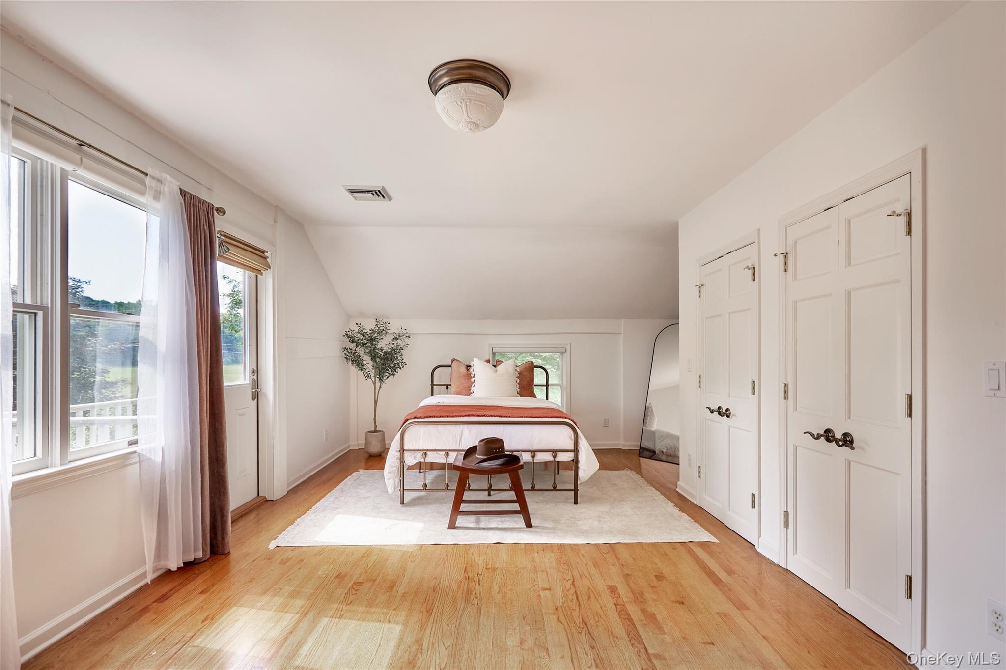 2039 Salt Point Turnpike Salt Point, NY 12578 - Photo 18 of 35 a view of a bedroom with wooden floor and windows