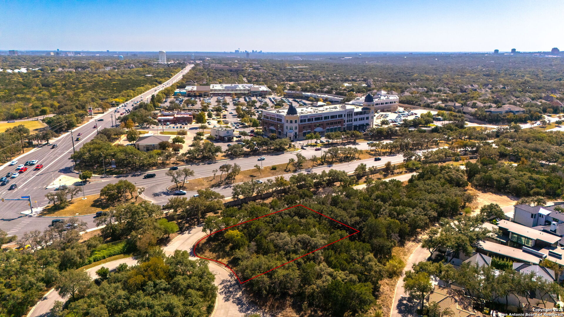 an aerial view of residential building and ocean view