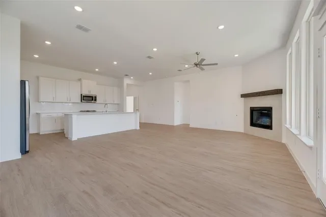 a view of a kitchen with a sink and a stove top oven