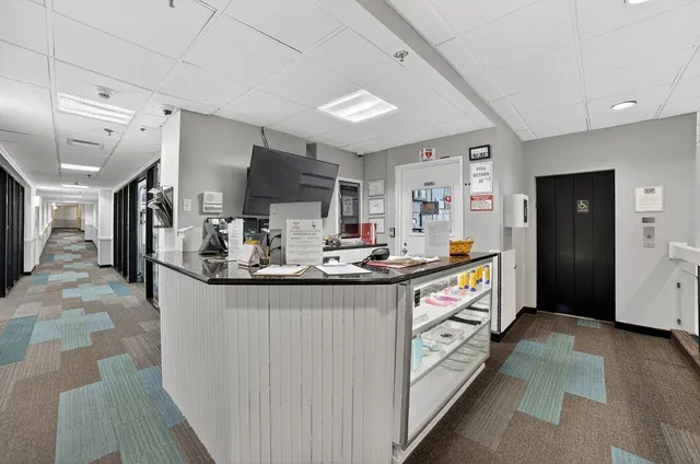 a swimming pool with outdoor seating and garden