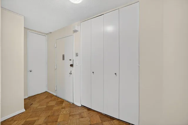 a bathroom with a toilet and bathtub