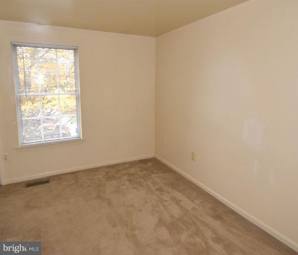 16 Tabiona Court Silver Spring, MD 20906 - Photo 6 of 12 an empty room with a window