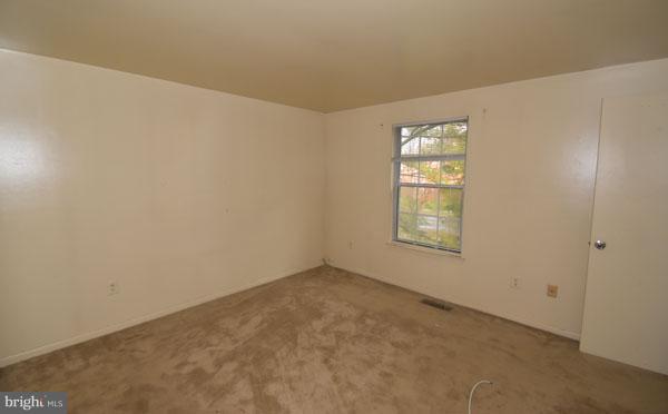 16 Tabiona Court Silver Spring, MD 20906 - Photo 8 of 12 an empty room with windows