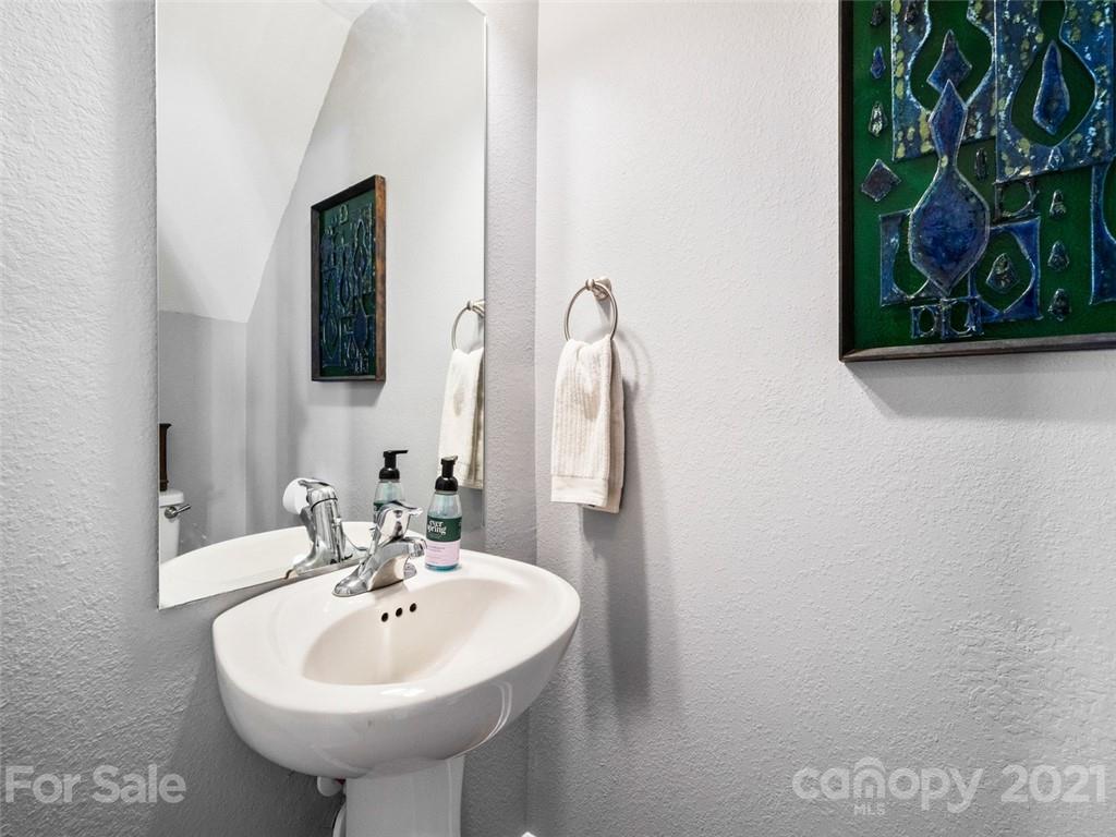 6823 Ware Road Charlotte, NC 28212 - Photo 17 of 47 a bathroom with a sink and a mirror