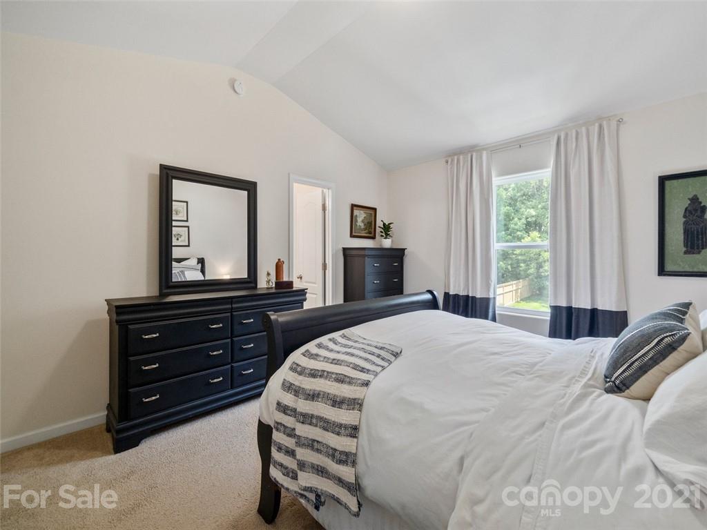 6823 Ware Road Charlotte, NC 28212 - Photo 19 of 47 a bedroom with a bed and a dresser