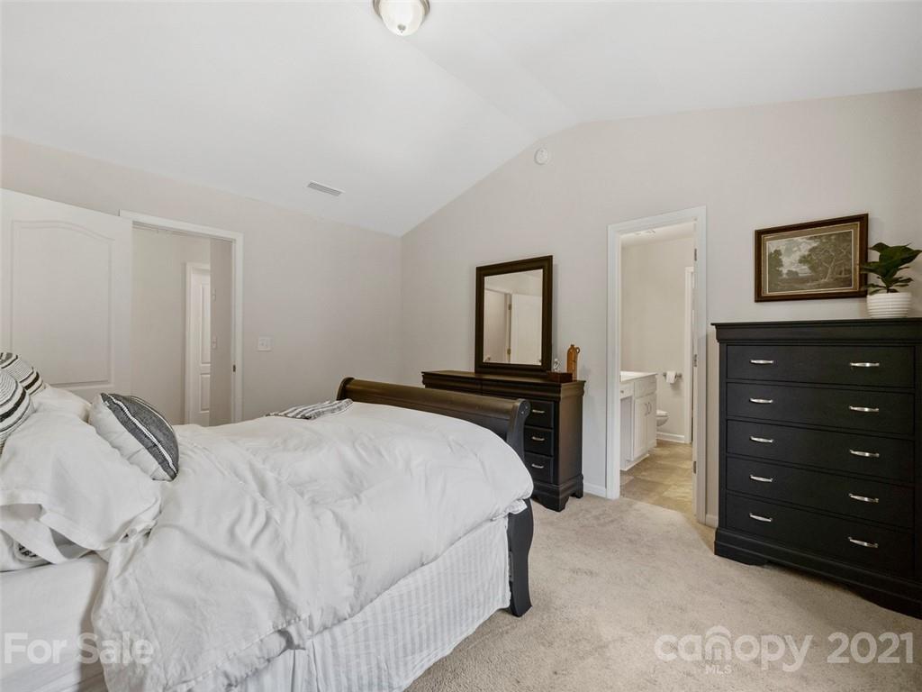 6823 Ware Road Charlotte, NC 28212 - Photo 20 of 47 a bedroom with a bed and a tv