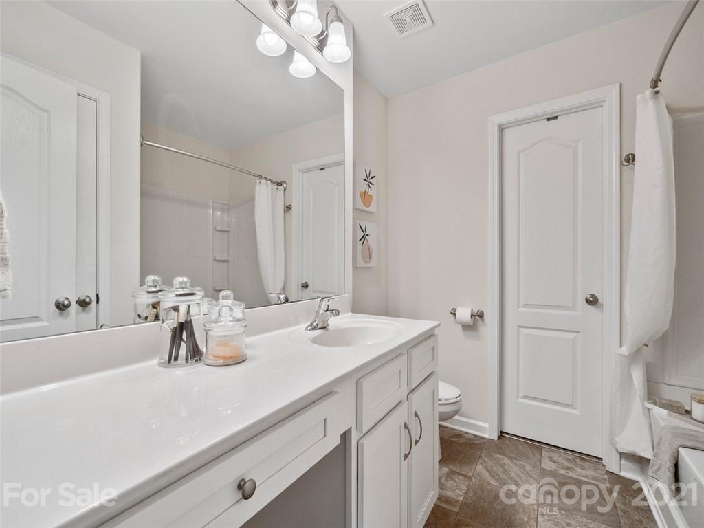 6823 Ware Road Charlotte, NC 28212 - Photo 22 of 47 a bathroom with a sink double vanity and a mirror