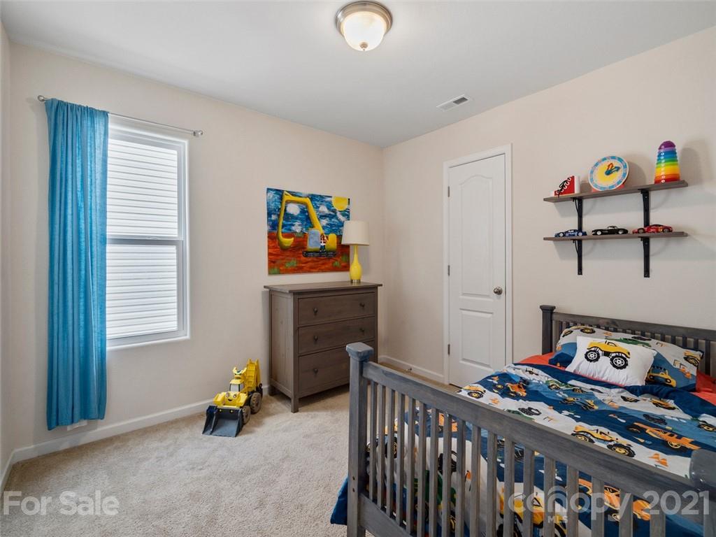 6823 Ware Road Charlotte, NC 28212 - Photo 30 of 47 a bedroom with a bed and a window
