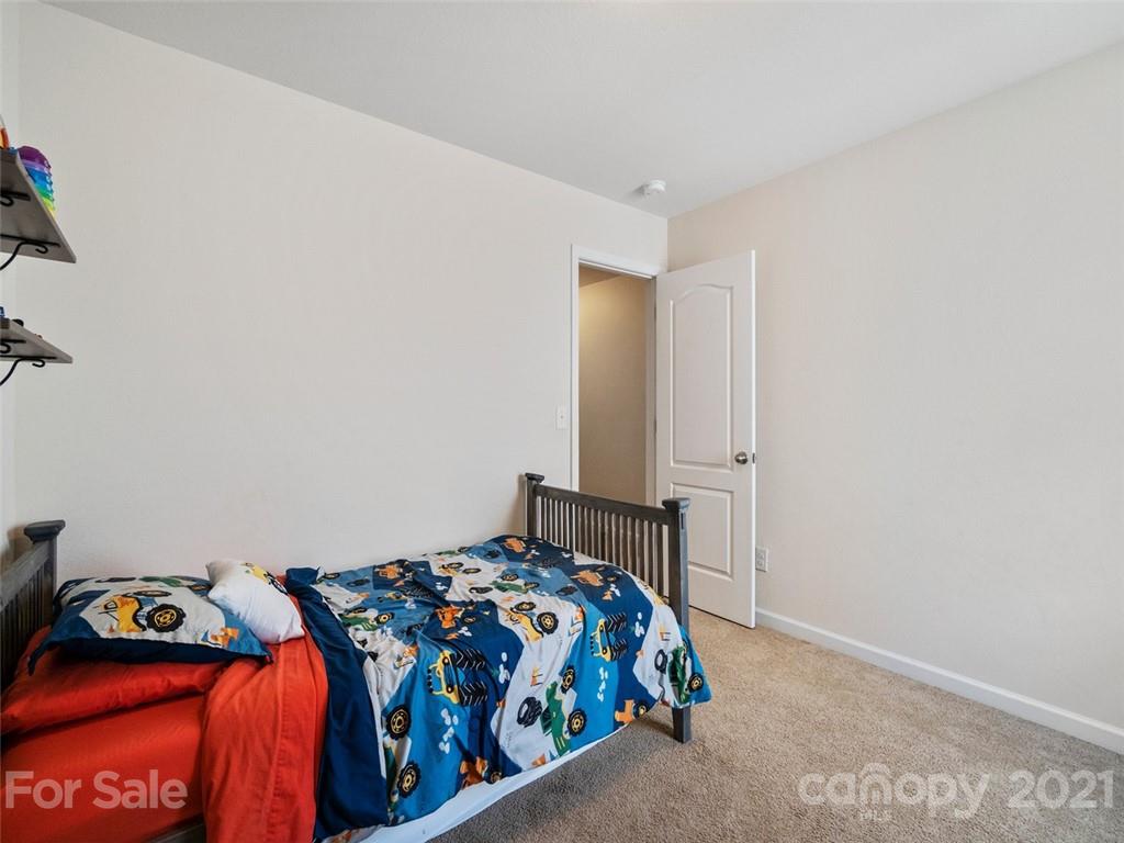 6823 Ware Road Charlotte, NC 28212 - Photo 31 of 47 a bedroom with a bed and window