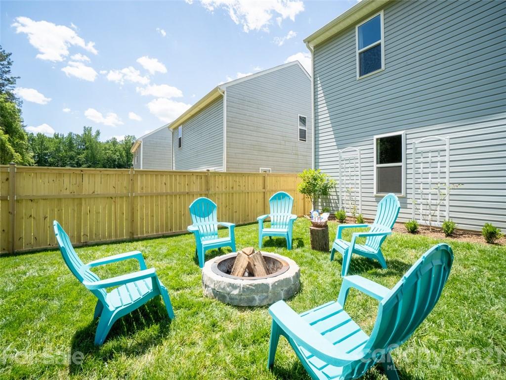 6823 Ware Road Charlotte, NC 28212 - Photo 36 of 47 a view of a chairs and table in the patio
