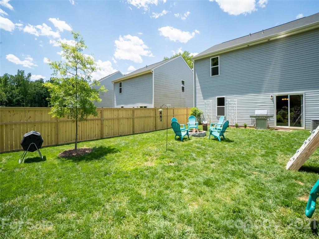 6823 Ware Road Charlotte, NC 28212 - Photo 37 of 47 a backyard of a house with table and chairs