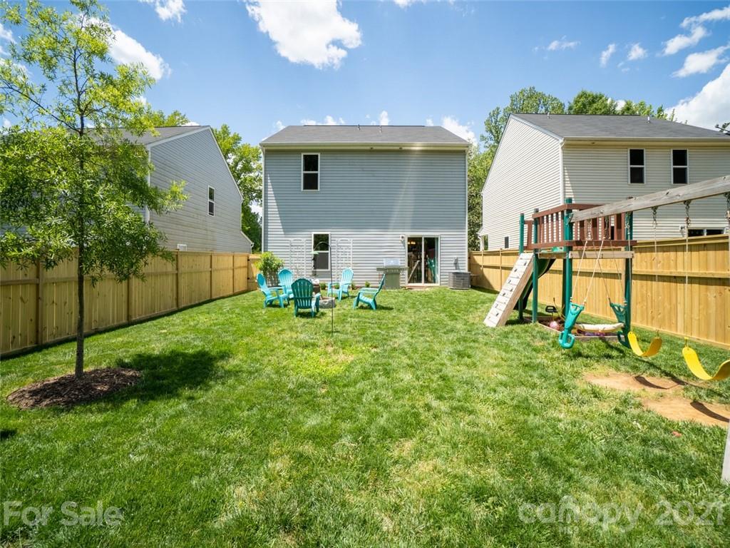 6823 Ware Road Charlotte, NC 28212 - Photo 39 of 47 a view of a house with backyard and a patio