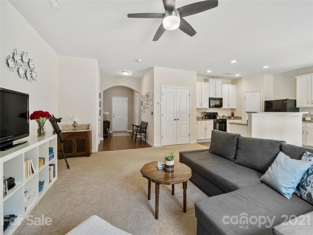 6823 Ware Road Charlotte, NC 28212 - Photo 6 of 47 a living room with furniture and a flat screen tv
