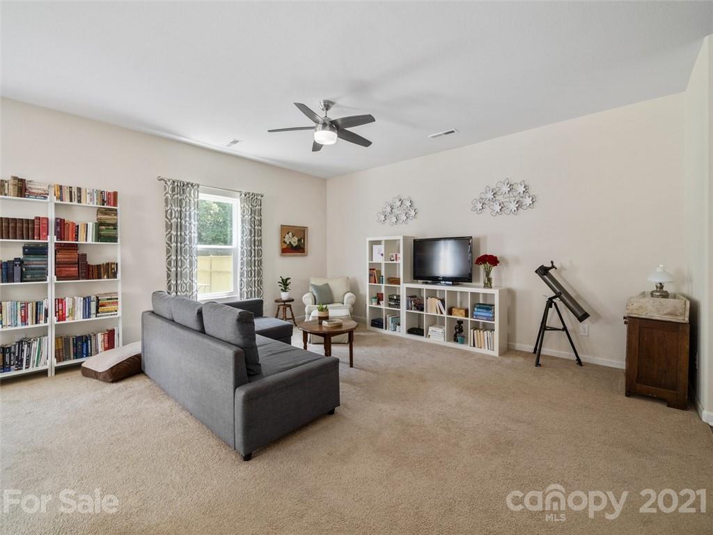 6823 Ware Road Charlotte, NC 28212 - Photo 8 of 47 a living room with furniture and a flat screen tv