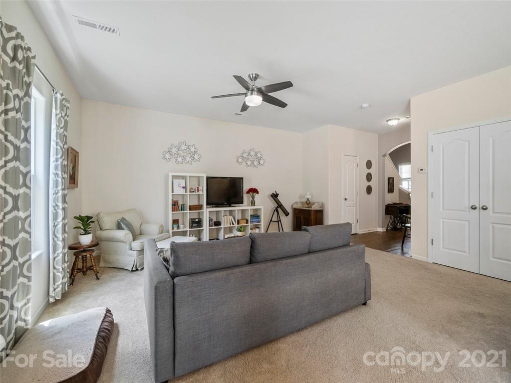 6823 Ware Road Charlotte, NC 28212 - Photo 9 of 47 a living room with furniture and a chandelier