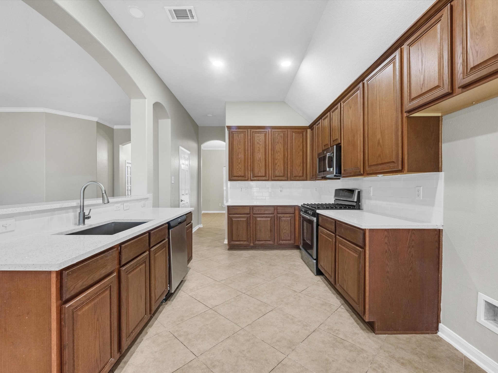 5122 Dripping Spring Avenue Baytown, TX 77523 - Photo 17 of 33 Spacious kitchen design with updated counters and ample cabinetry storage