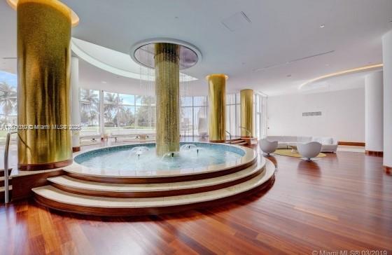 5161 Collins Avenue, Unit 715 Miami Beach, FL 33140 - Photo 21 of 31 a view of dining room with wooden floor and dining table