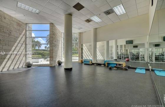5161 Collins Avenue, Unit 715 Miami Beach, FL 33140 - Photo 31 of 31 a view of room with gym equipment
