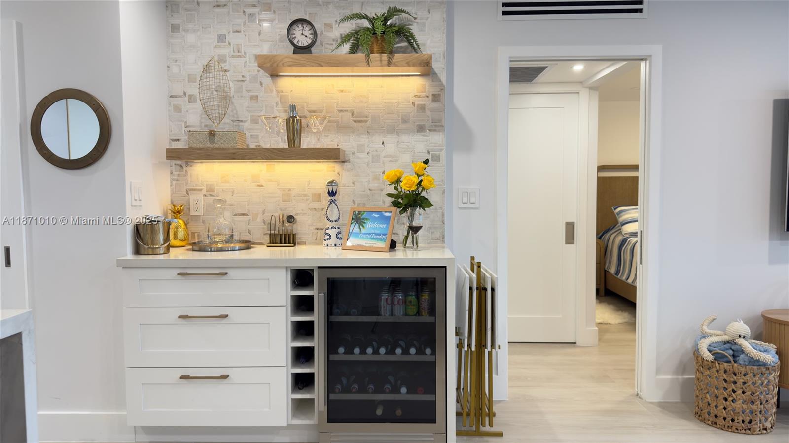 5161 Collins Avenue, Unit 715 Miami Beach, FL 33140 - Photo 6 of 31 a bathroom with a sink and a mirror