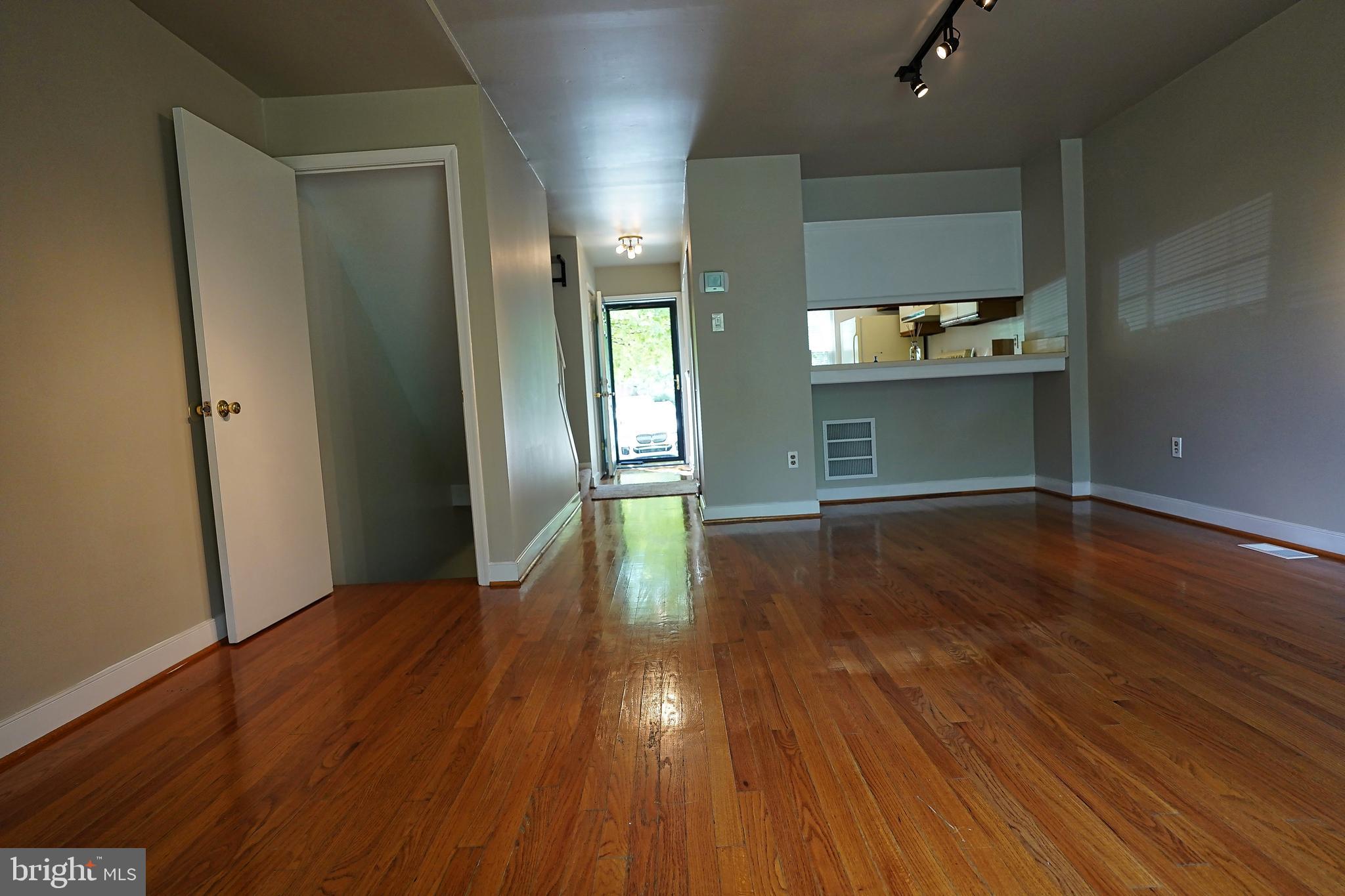 6948 Rockfield Road Baltimore, MD 21244 - Photo 46 of 47 wooden floor in an empty room with a window