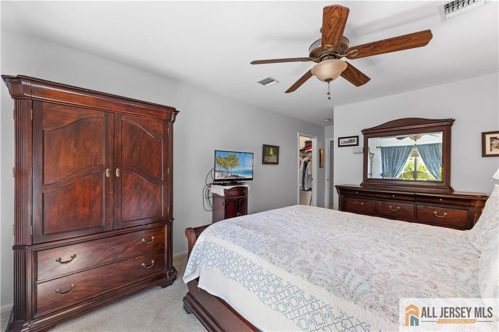 28 Garfield Way Princeton, NJ 08540 - Photo 4 of 39 a bedroom with a bed and a dresser