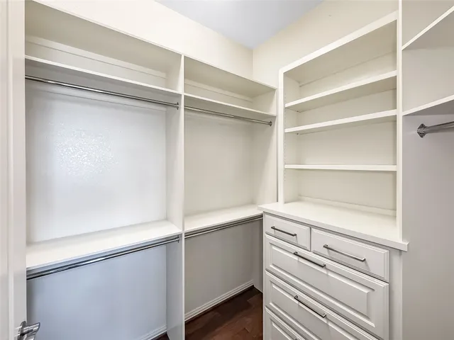 a view of an empty walk in closet