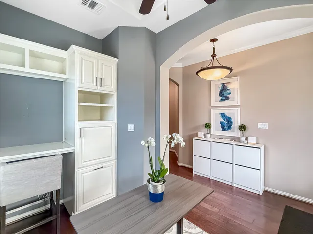 a kitchen with a sink cabinets and appliances