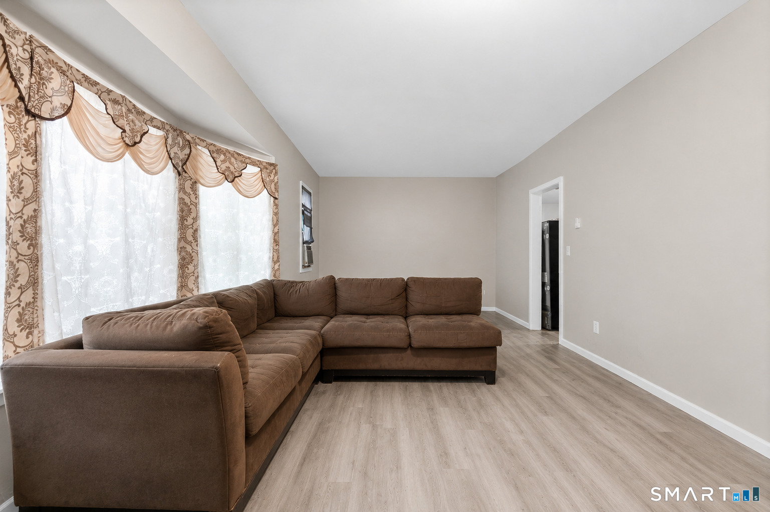 135 Prospect Street Waterbury, CT 06710 - Photo 3 of 19 a living room with furniture and a large window