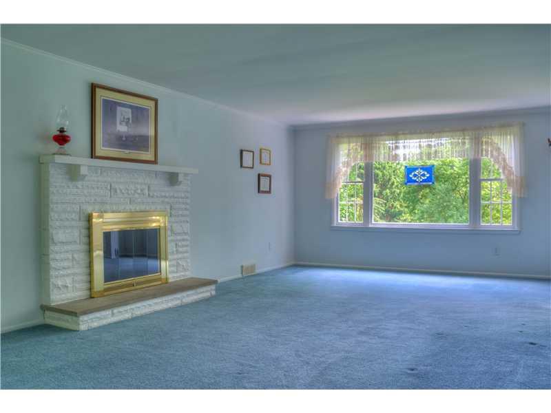 401 McKinney Road Wexford, PA 15090 - Photo 2 of 16 Living Room. Spacious living room with fireplace and lots of natural. You will find hardwood floors under the carpet