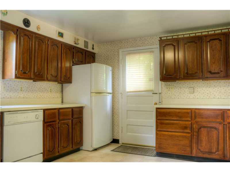 401 McKinney Road Wexford, PA 15090 - Photo 6 of 16 Kitchen. this view shows the additional cabinetry and the door to the deck and rear yard.