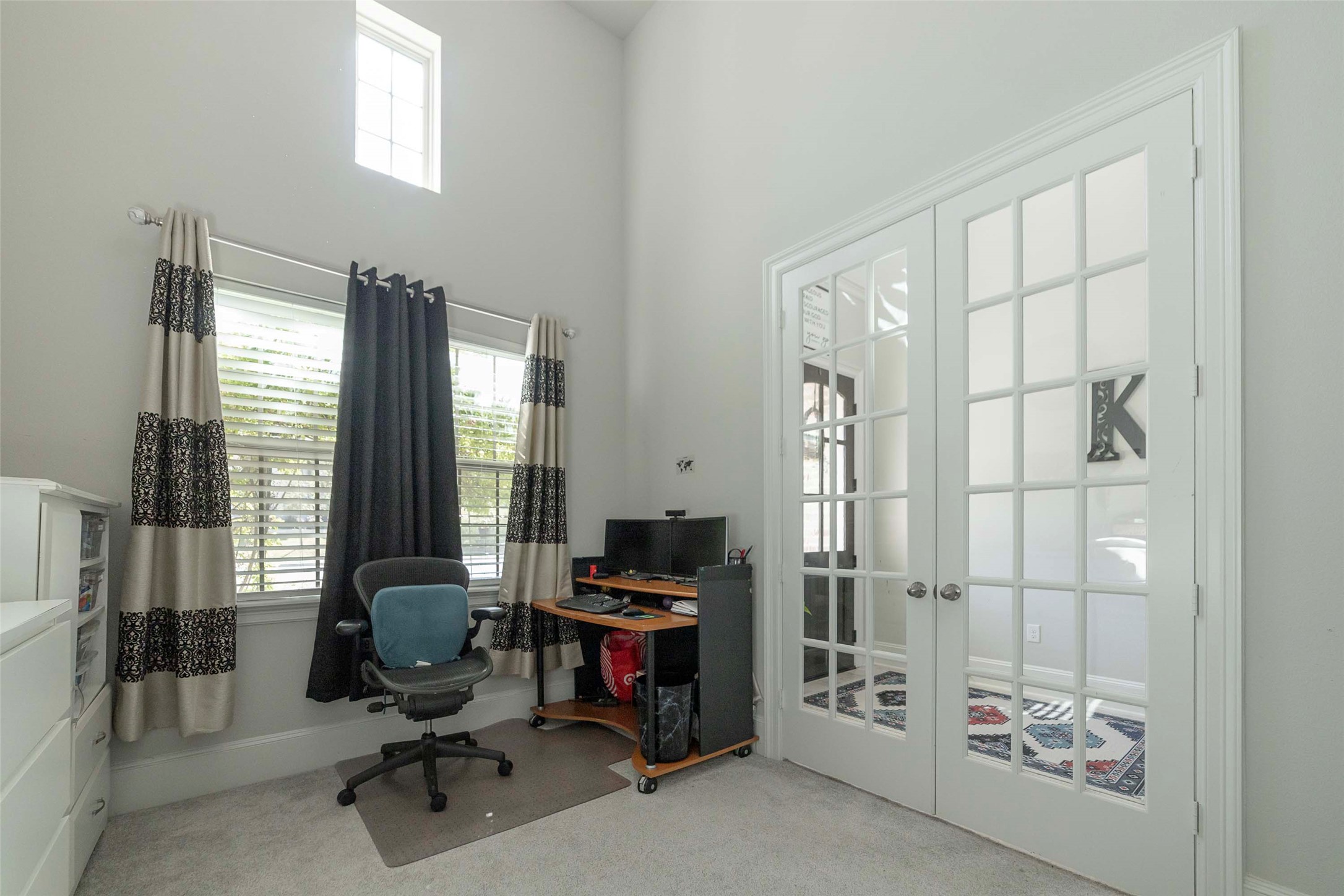 17821 Limestone Spring Lane Austin, TX 78738 - Photo 18 of 40 a view of a workspace with furniture and a window