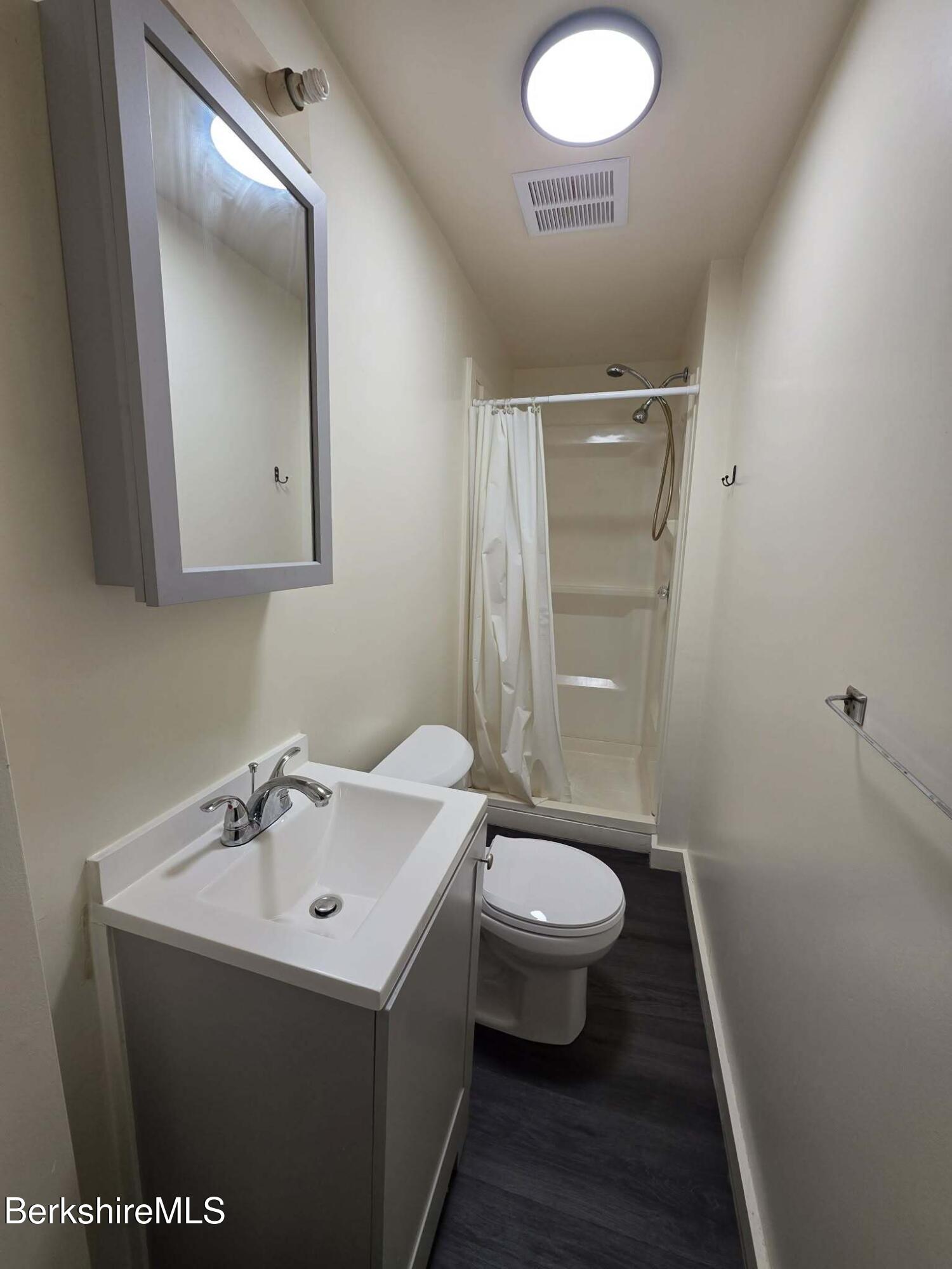 35 Pleasant Street Adams, MA 01220 - Photo 7 of 7 a bathroom with a sink and a mirror